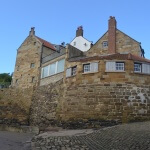 Stone cliff edge at the village of Robin Hoods Bay